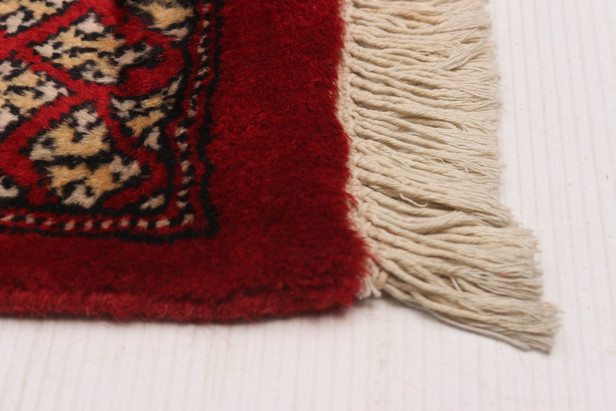 Peshawar Bokhara rug, corner detail