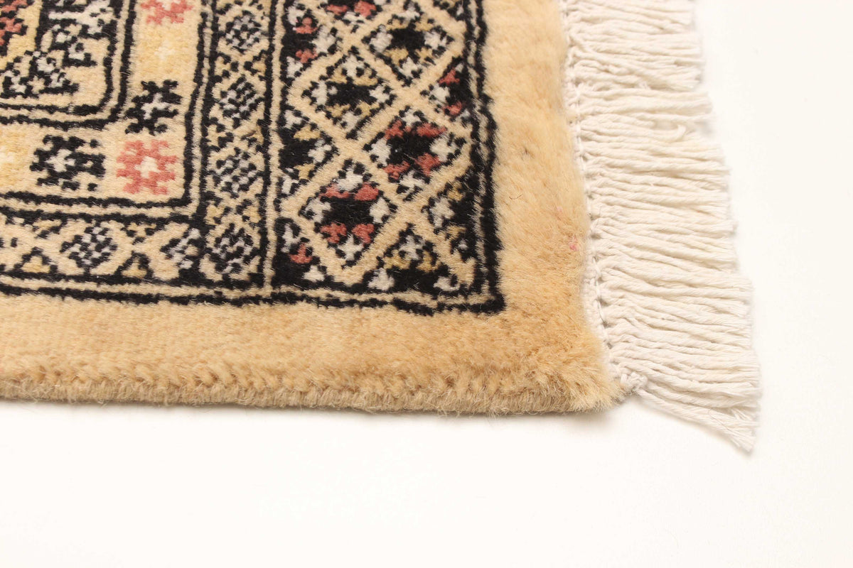 Peshawar Bokhara rug, corner detail