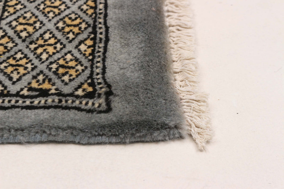 Peshawar Bokhara rug, corner detail