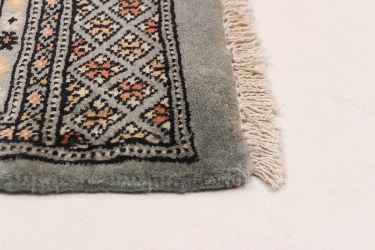 Peshawar Bokhara rug, corner detail