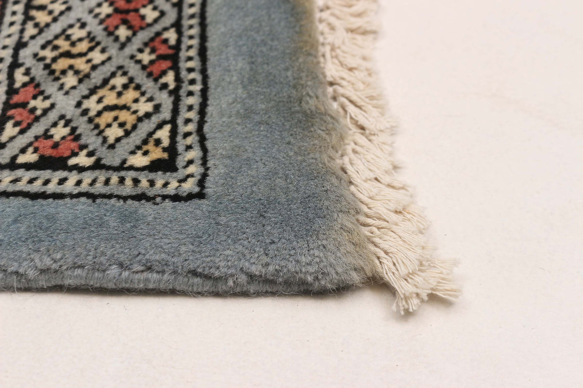 Peshawar Bokhara rug, corner detail
