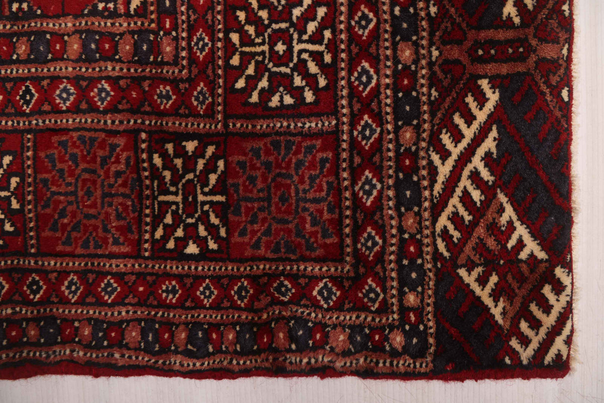 Peshawar Bokhara rug, corner detail